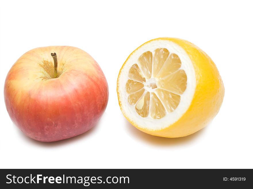 Apple and lemon on the whie isolated background