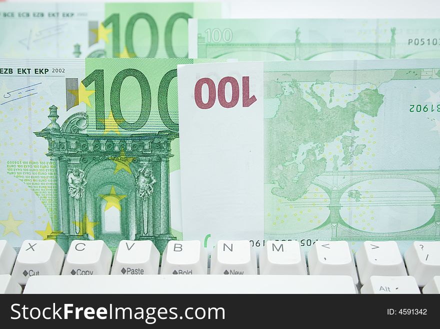 Some 100 euros banknotes on the keyboard