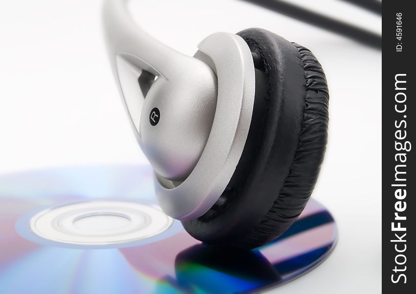 Headphones and cd on a white background