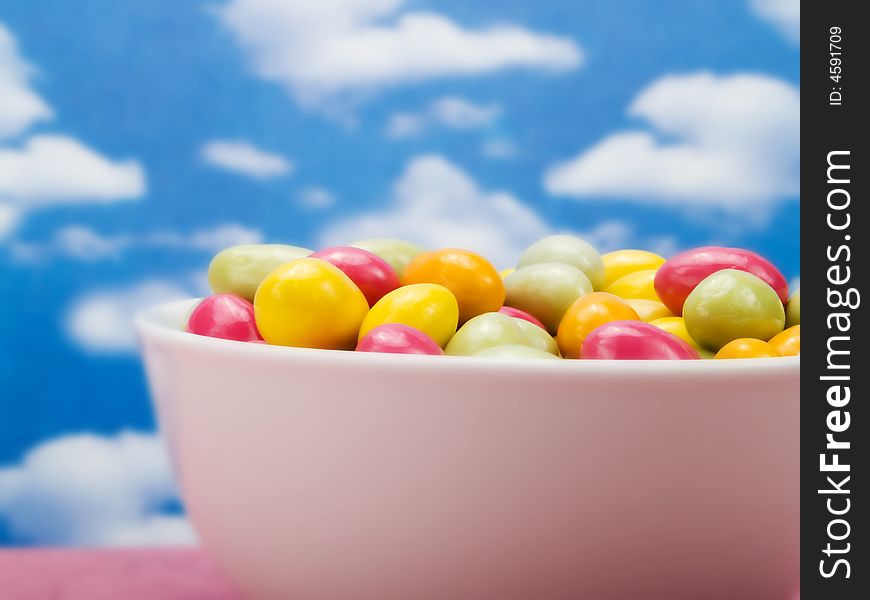 Colorful candies over a blue sky