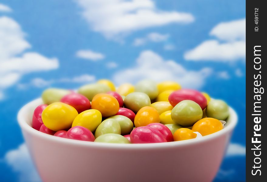 Colorful candies over a blue sky