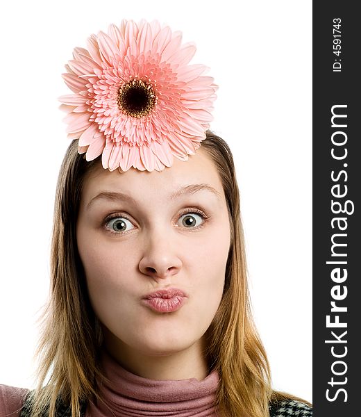 Grimacing girl with flower over head