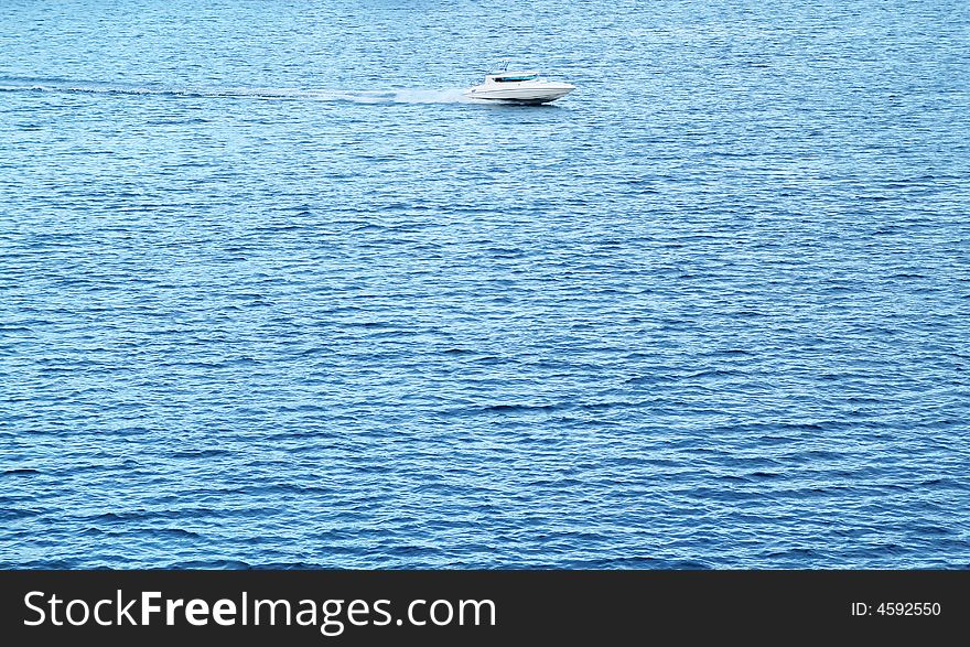 Small and lonely boat on the big sea