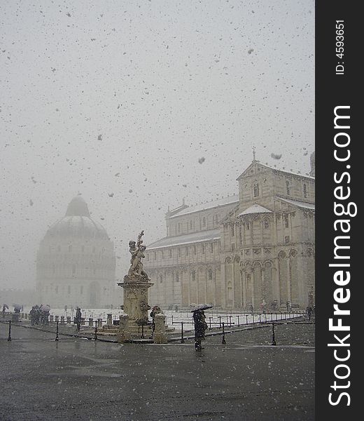Pisa cathedral and baptistery surrounded by snow. Pisa cathedral and baptistery surrounded by snow