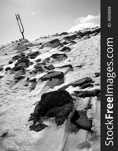 Winter monochrome landscape with stones and guidepost in Krkonose (the highest mountains in Czech republic). Winter monochrome landscape with stones and guidepost in Krkonose (the highest mountains in Czech republic)