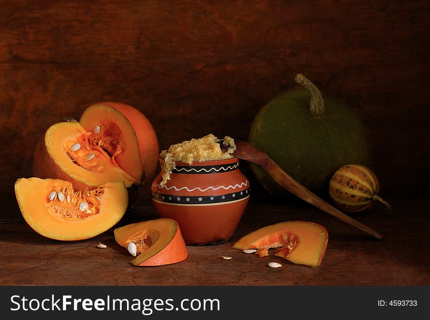 Pumpkin porridge with a wooden spoon