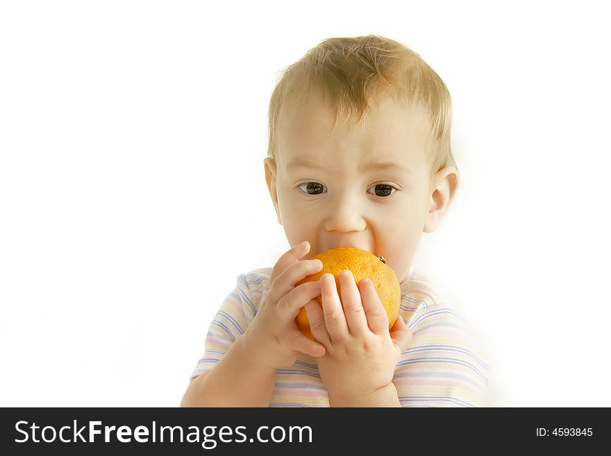 Baby eating orange over white