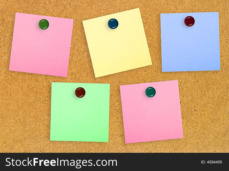 Colorful note paper on wood background