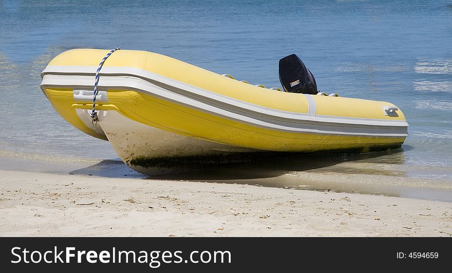 Yellow Inflatable Dingy on Sandy Beach on St. John Island, US Virgin Islands. Yellow Inflatable Dingy on Sandy Beach on St. John Island, US Virgin Islands.