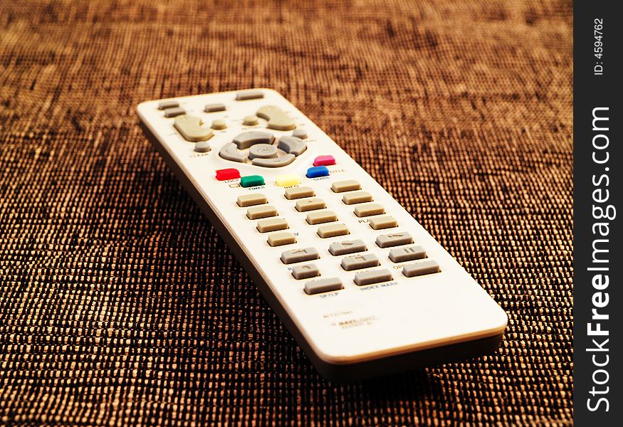 Remote tv control with shallow depth of field and unusual background