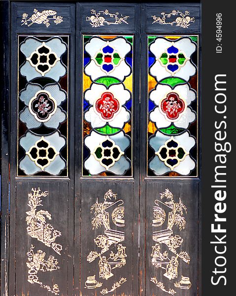 Chinese wood screen with colorful engraved glass and golden lacquer wood carving. Chinese wood screen with colorful engraved glass and golden lacquer wood carving.