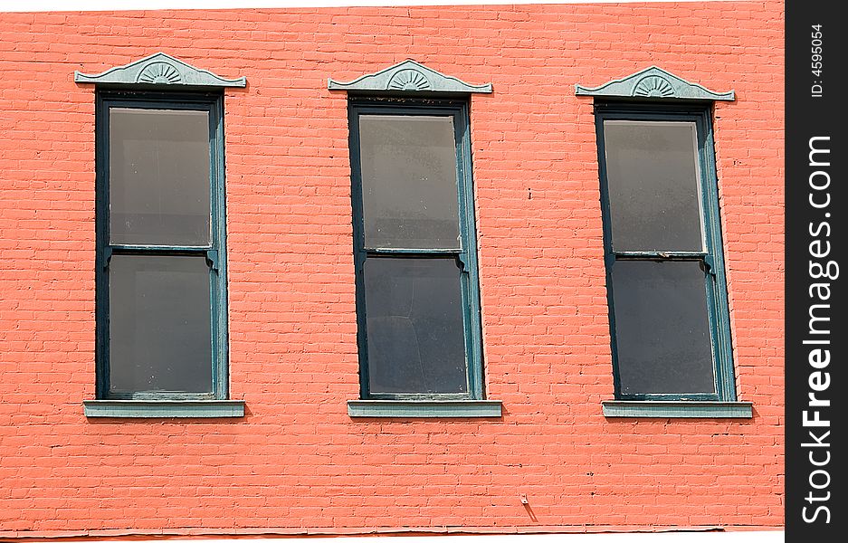 Three windows on wall of old building. Three windows on wall of old building