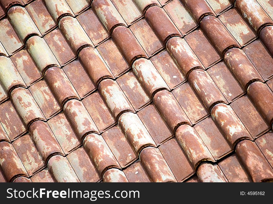 Antique metal roof tiles in diagonal pattern. Antique metal roof tiles in diagonal pattern