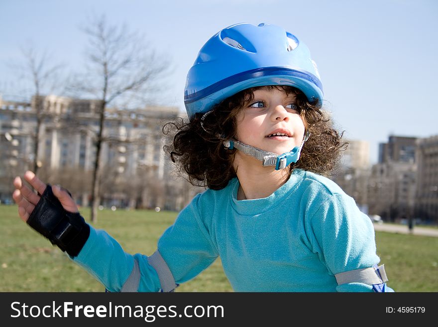 Little girl having fun roller blading in the park. Little girl having fun roller blading in the park.