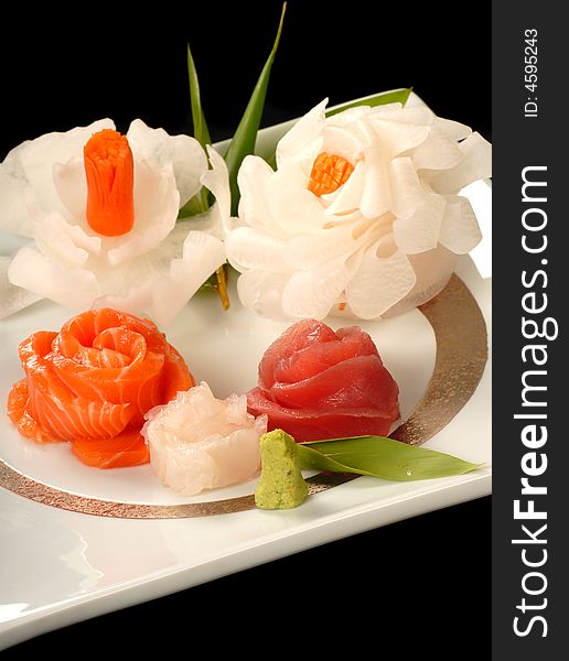 Fresh asian salmon and tuna sashimi made in the shape of flowers. Fresh asian salmon and tuna sashimi made in the shape of flowers