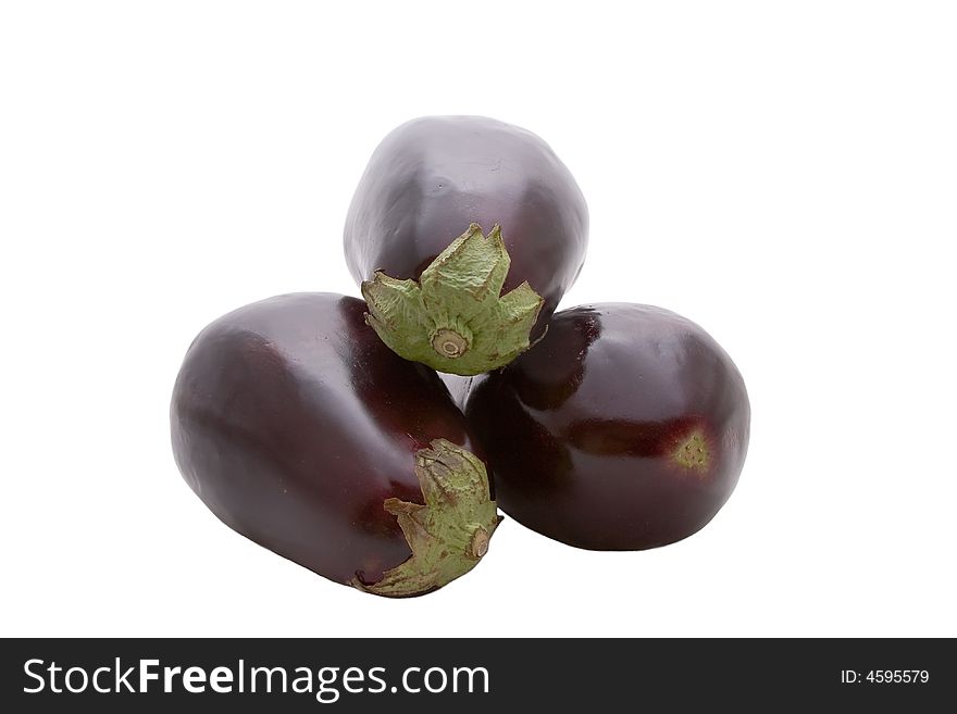 Three Aubergines or Egg plants against a white background