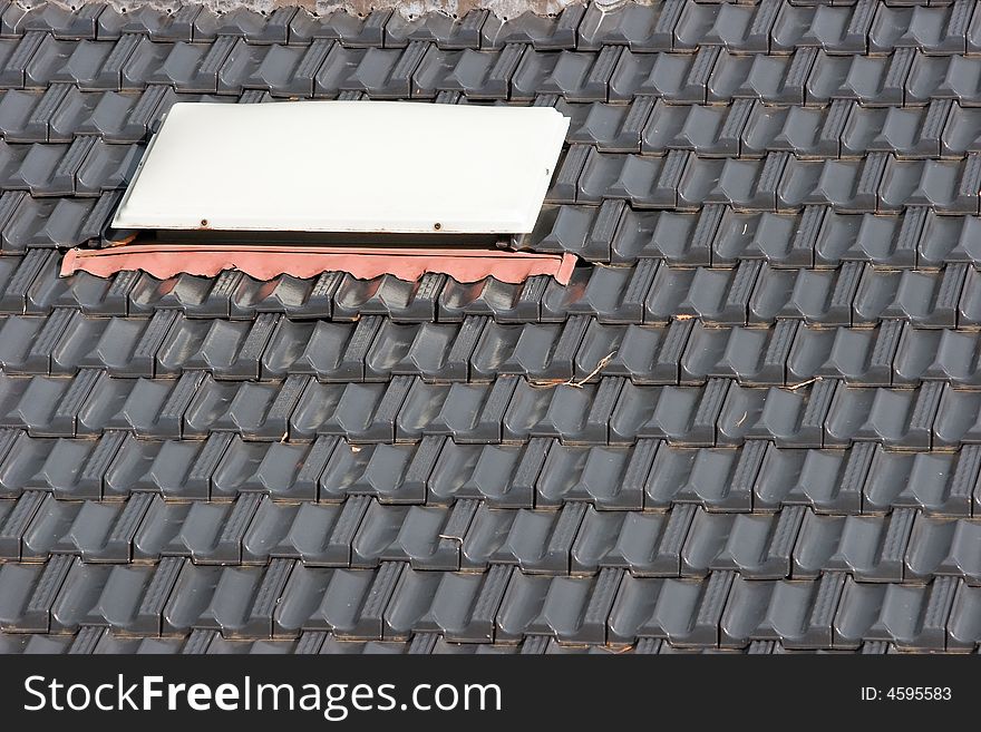A roof skylight and roof tiles