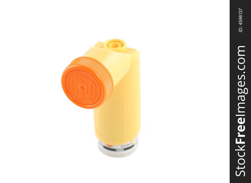 Yellow asthma inhaler with cap