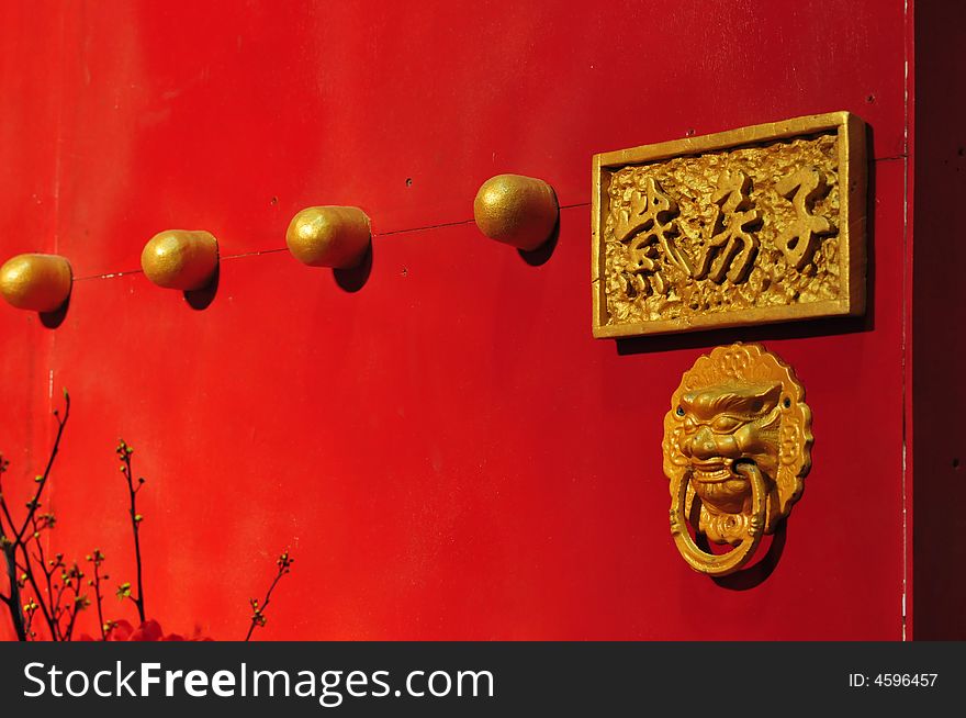 Traditional chinese red door with gold decoration
