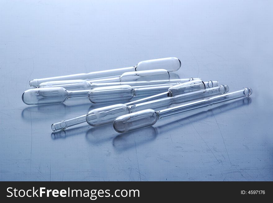 Chemistry tube In blue tones on laboratory table