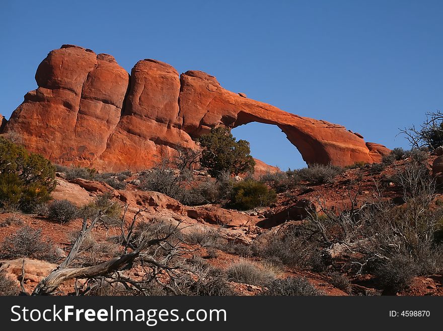 View of the red rock formations in Arches National Park with blue sky�s and clouds. View of the red rock formations in Arches National Park with blue sky�s and clouds