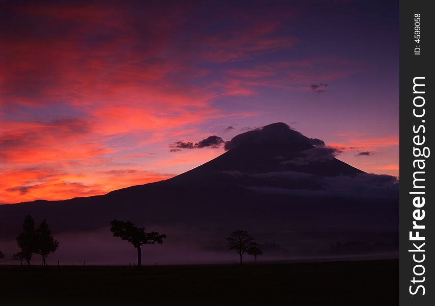 A fiery sunrise over the silhouette of sacred Fuji. A fiery sunrise over the silhouette of sacred Fuji