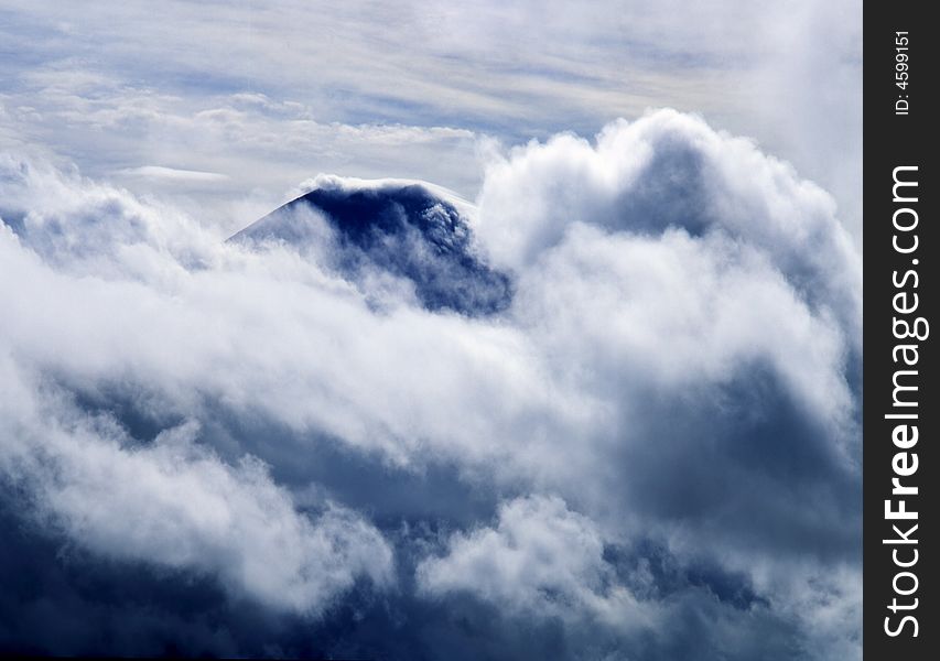 Mount Fuji enshrouded in clouds. Mount Fuji enshrouded in clouds