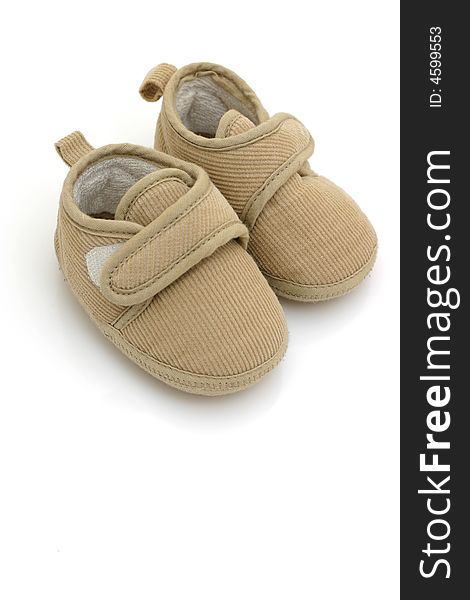 Baby's shoes on white background