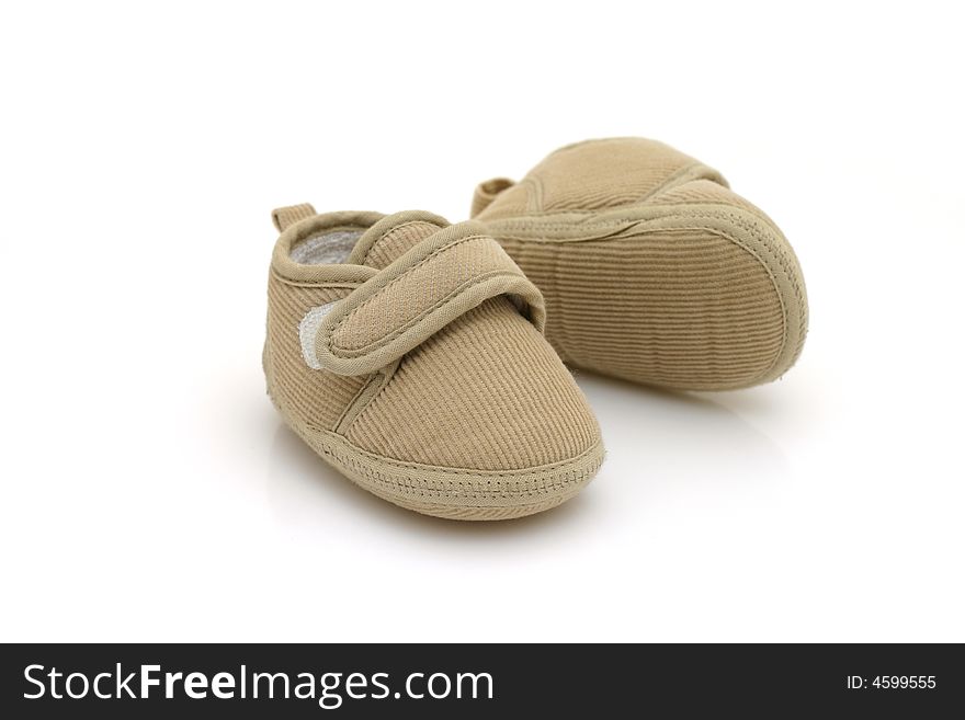 Baby's shoes on white background