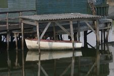Small White Boat Under An Old Roof Royalty Free Stock Image Small White Boat Under An Old Roof Royalty Free Stock Image