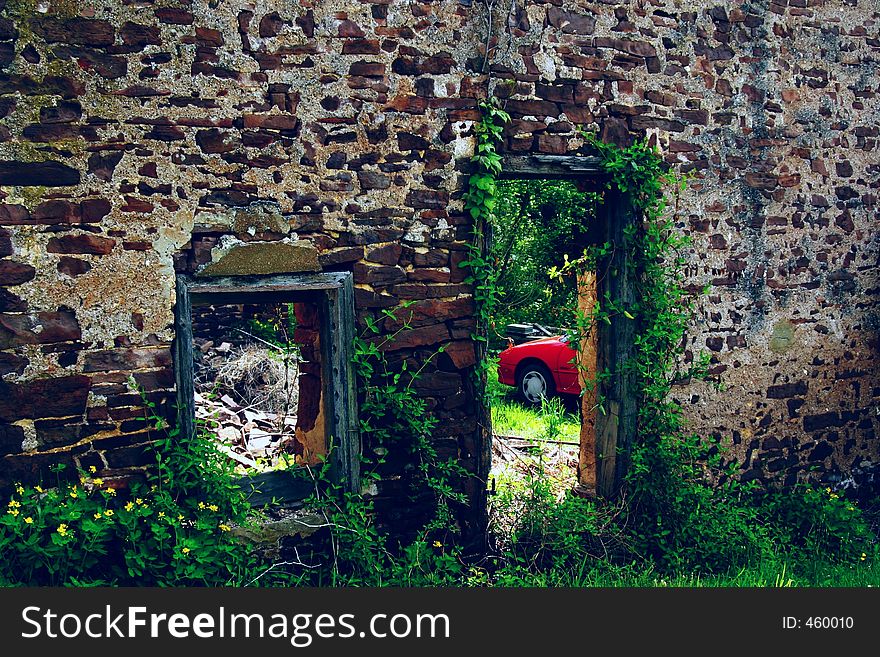 Stone Wall And Red Car