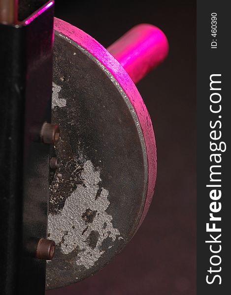 Worn barbell plate pink highlights