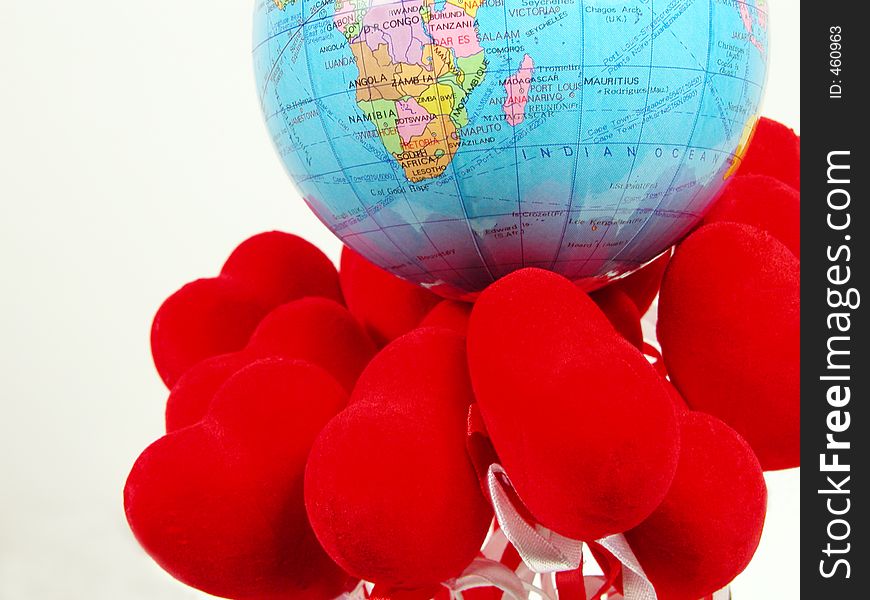 Earth globe on the red hearts. Earth globe on the red hearts