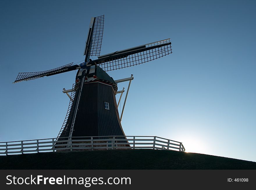 Windmill silhouette at sunset. Windmill silhouette at sunset