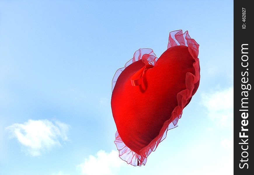 Isolated floating heart against sky with room for copy ,text