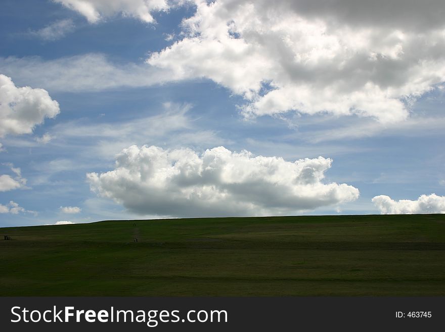 Beautiful field and blue cloudy sky. Beautiful field and blue cloudy sky.