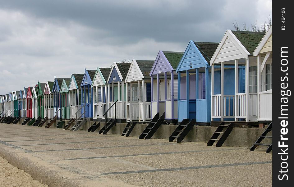 A row of English sea-side beach-huts. A row of English sea-side beach-huts