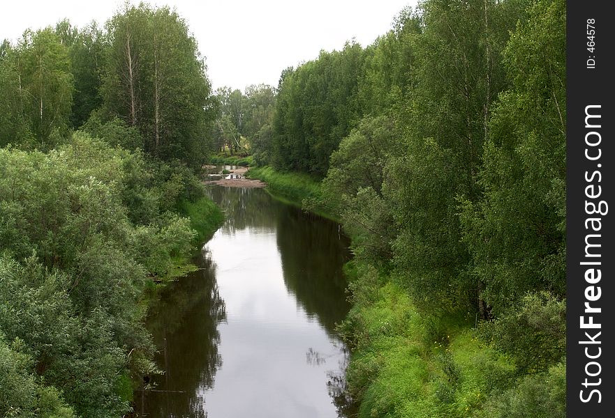 Unhurried calm river in the forest. Unhurried calm river in the forest