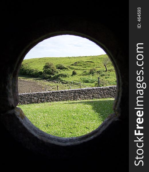 A view through a porthole at Rosserk Friary, Co. Mayo, Ireland. A view through a porthole at Rosserk Friary, Co. Mayo, Ireland