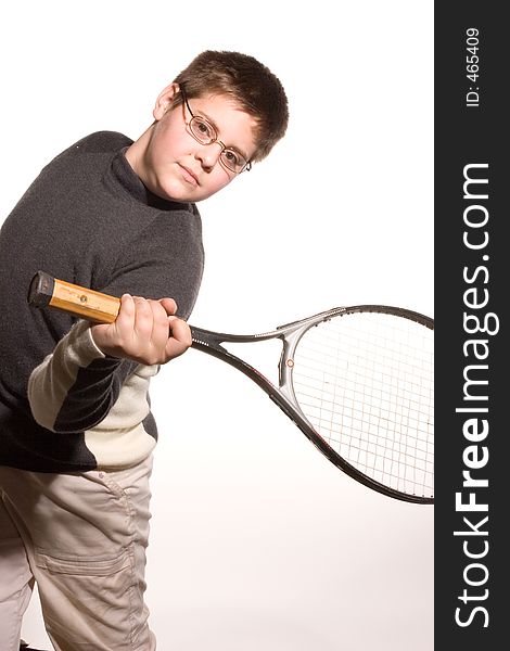 Boy playing with tennis racket. Boy playing with tennis racket