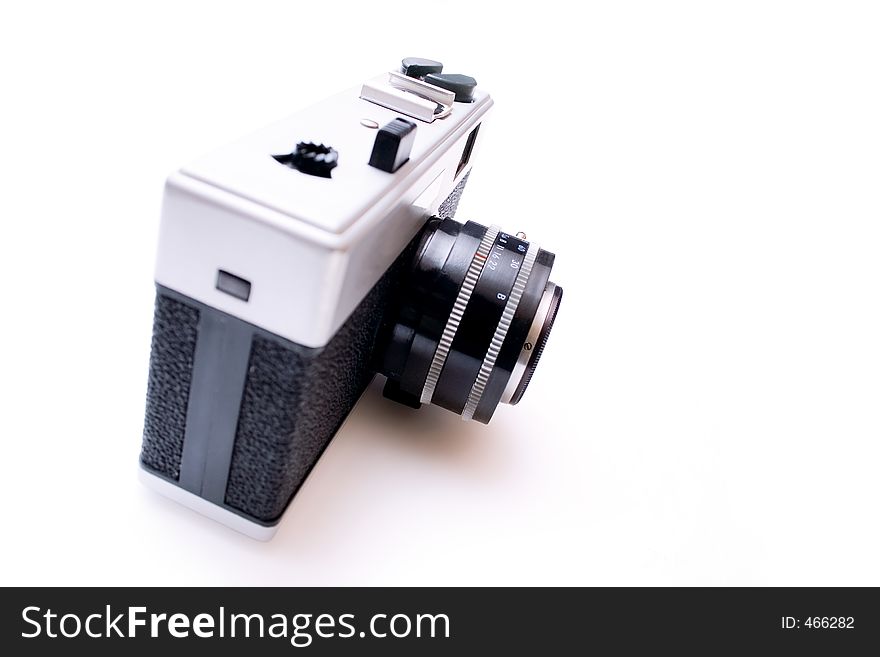 Vintage camera isolated on white background - shallow DOF. Vintage camera isolated on white background - shallow DOF