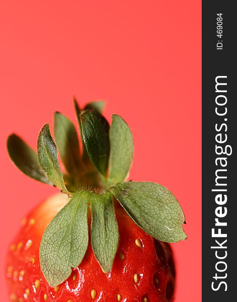 Half strawberry with red background