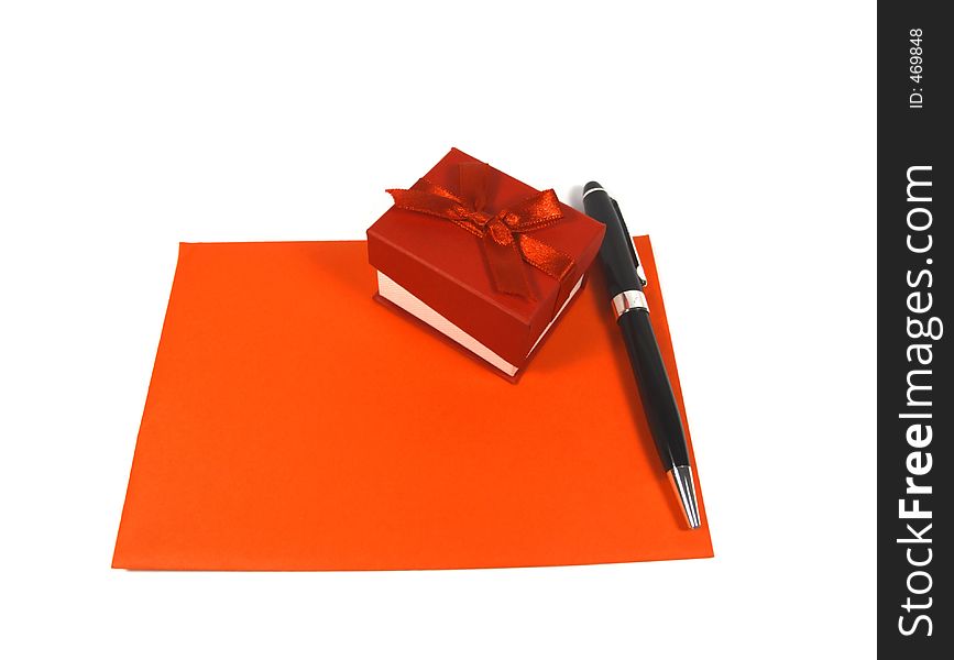Red valentine present, pen and envelope