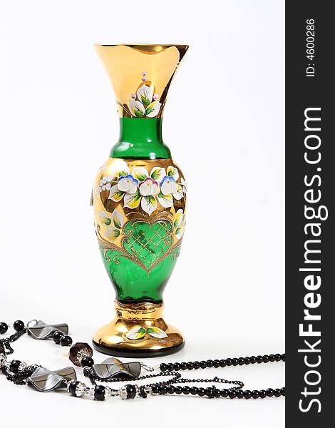 Crystal green vase and black beads. Crystal green vase and black beads