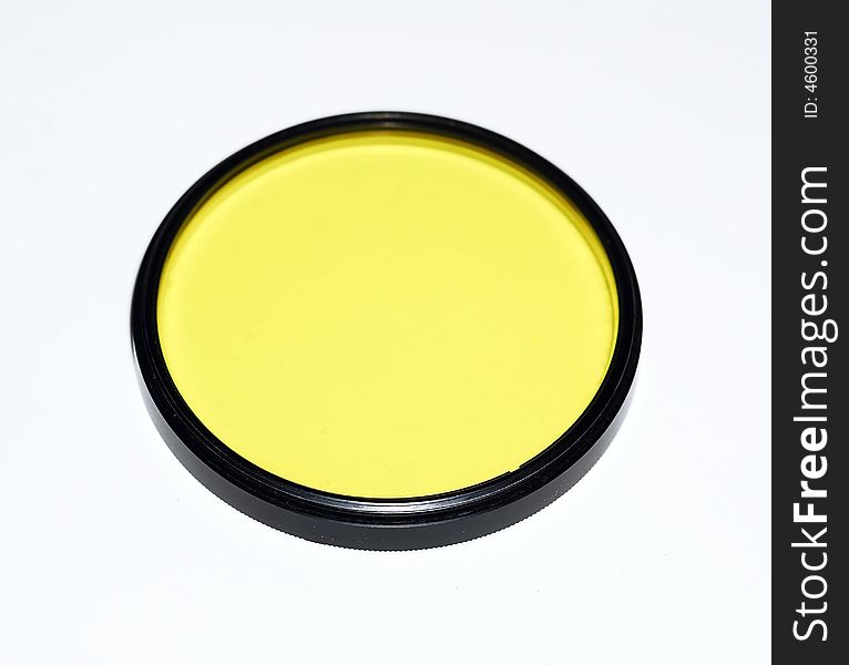 Yellow filter for camera on white background