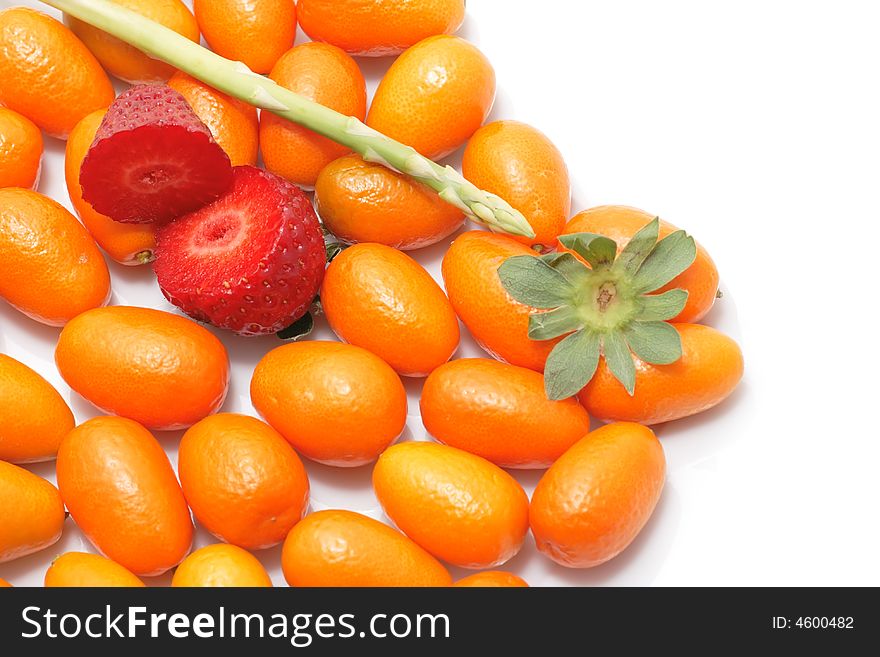 A lot of kumquats an two half berry. A lot of kumquats an two half berry