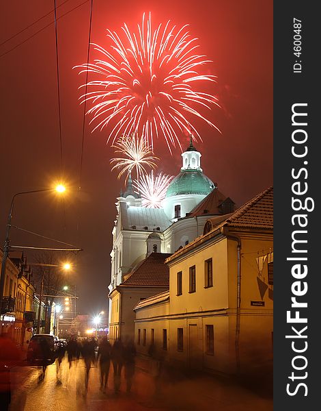 Celebratory fireworks behind a Catholic church