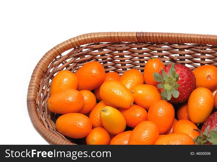 A lot of kumquats and strawberry isolated on the white background. A lot of kumquats and strawberry isolated on the white background