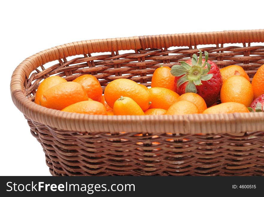 A lot of kumquats an strawberry isolated on the white background