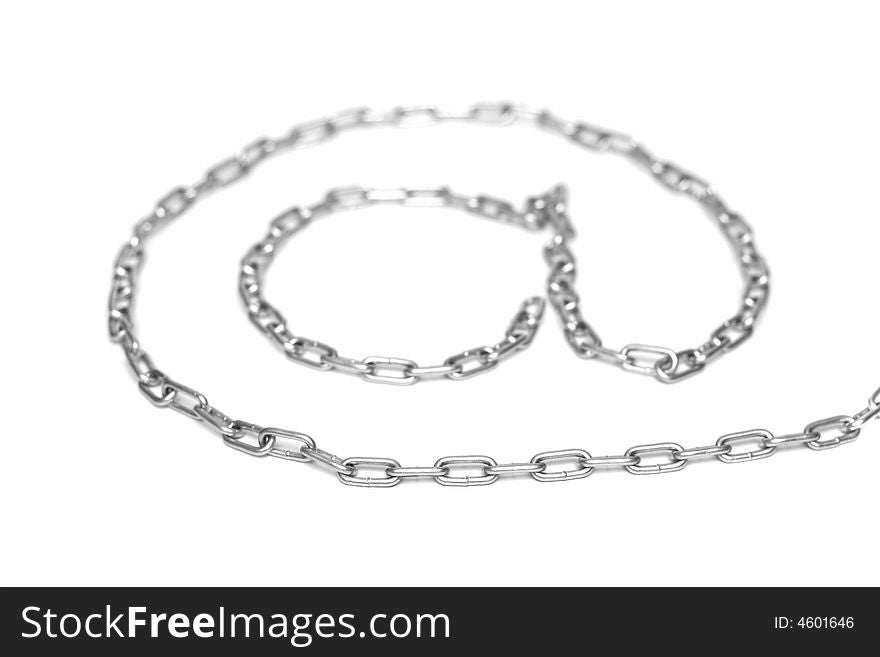 Metallic chain on white background, abstraction